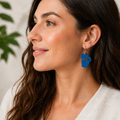  3Woman wearing blue Lake Tahoe mountain earrings, cobalt sculpted dangle earrings, Sierra Nevada jewelry